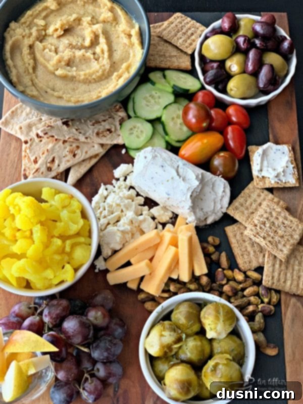 overhead of Mediterranean Inspired Cheeseboard with Cauliflower Hummus