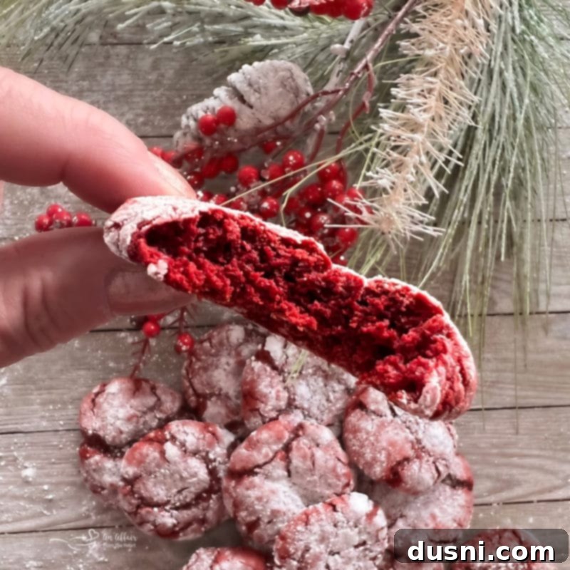 Red Velvet Cake Mix Cookies Close-up view of a pile of freshly baked red velvet cake mix cookies, showing their crinkled tops.