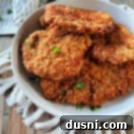 Breaded pork cutlets in a white serving dish