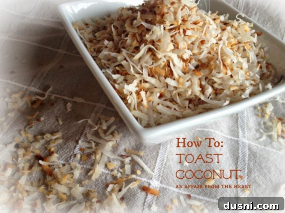 White bowl filled with golden toasted coconut flakes