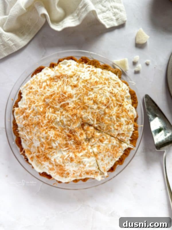 Close-up of creamy coconut custard filling inside a pie crust