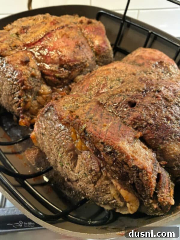 Perfectly cooked Italian Style Prime Rib Roast, ready to be carved