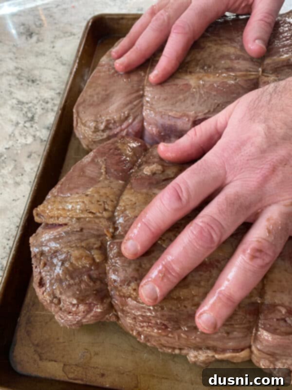 Seared prime rib roast removed from oven, ready for seasoning