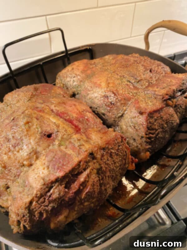 Digital instant-read thermometer checking internal temperature of prime rib