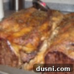 Finished prime rib in a roasting pan