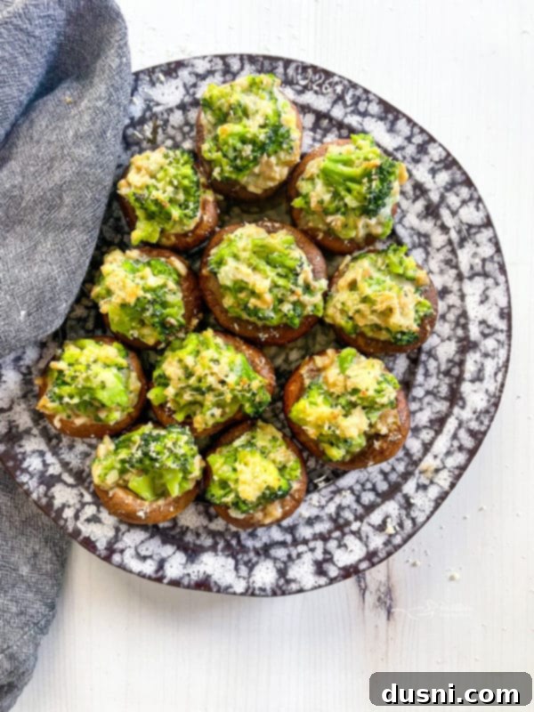 Stuffed Mushrooms Recipe A full plate of finished broccoli stuffed mushrooms, ready to be enjoyed.