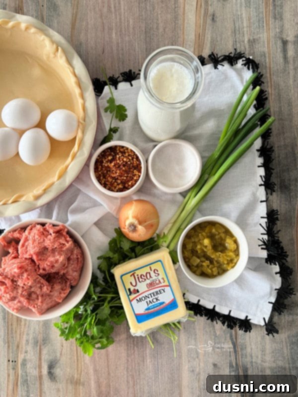 Sliced Green Chile Quiche with Sausage on a cutting board