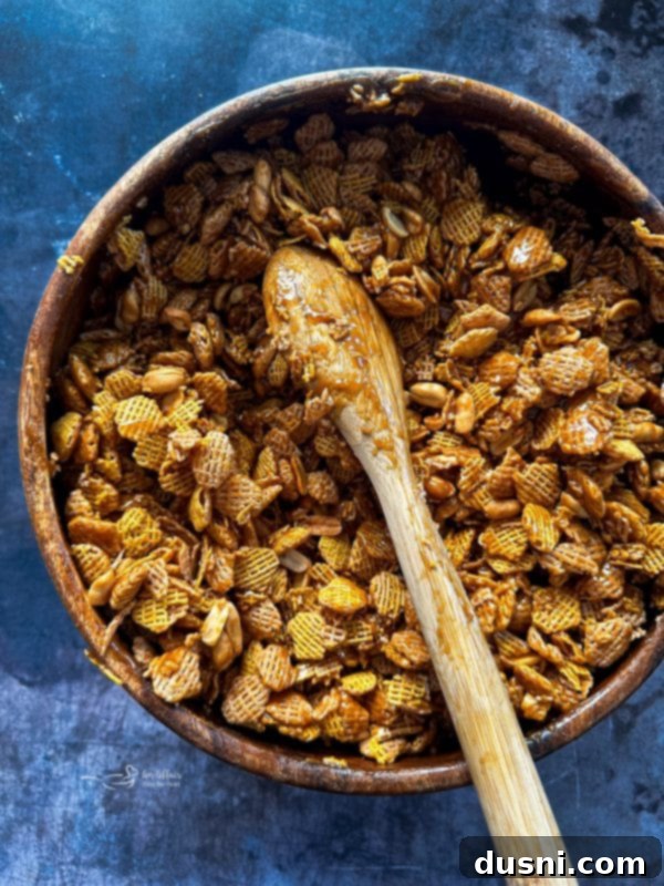 Foamy caramel mixture in a saucepan after baking soda has been stirred in.