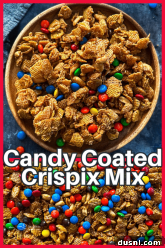 A bowl of Candy Coated Crispix Mix, with a festive ribbon, showcasing the delicious snack.