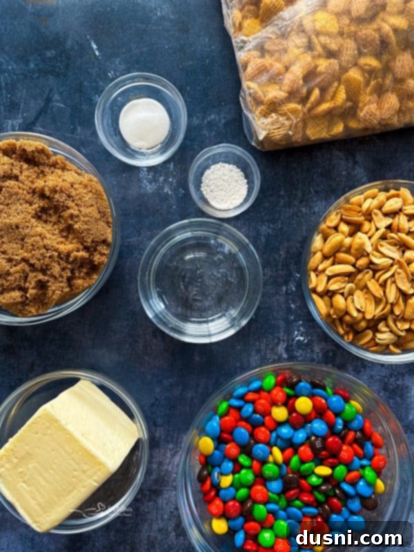 A serving bowl of Christmas Crispix Mix with red and green M&Ms, reflecting holiday colors.