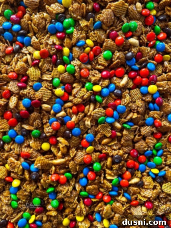 Ingredients for Crispix Mix laid out: Crispix cereal, brown sugar, butter, corn syrup, peanuts, and M&Ms.