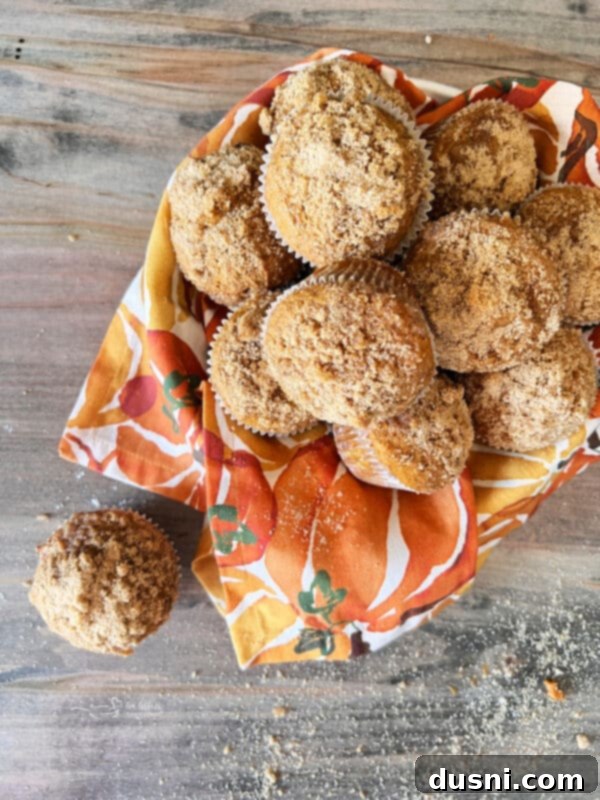 Autumn Spiced Banana Pumpkin Muffins 3 Close-up of golden brown Pumpkin Spice Banana Muffins, showcasing the crunchy streusel