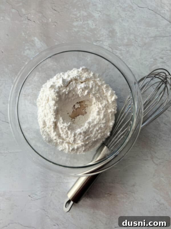 Raspberry Almond Shortbread Jewels 12 Warm, freshly baked Almond Raspberry Thumbprint Cookies on a cooling rack