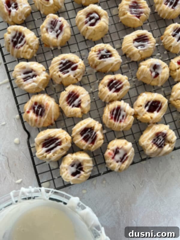 Raspberry Almond Shortbread Jewels 13 Process photo: Mixing powdered sugar, almond extract, and milk for the glaze