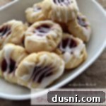 Raspberry Almond Shortbread Jewels 20 Almond Raspberry Shortbread Thumbprint Cookies on a white plate