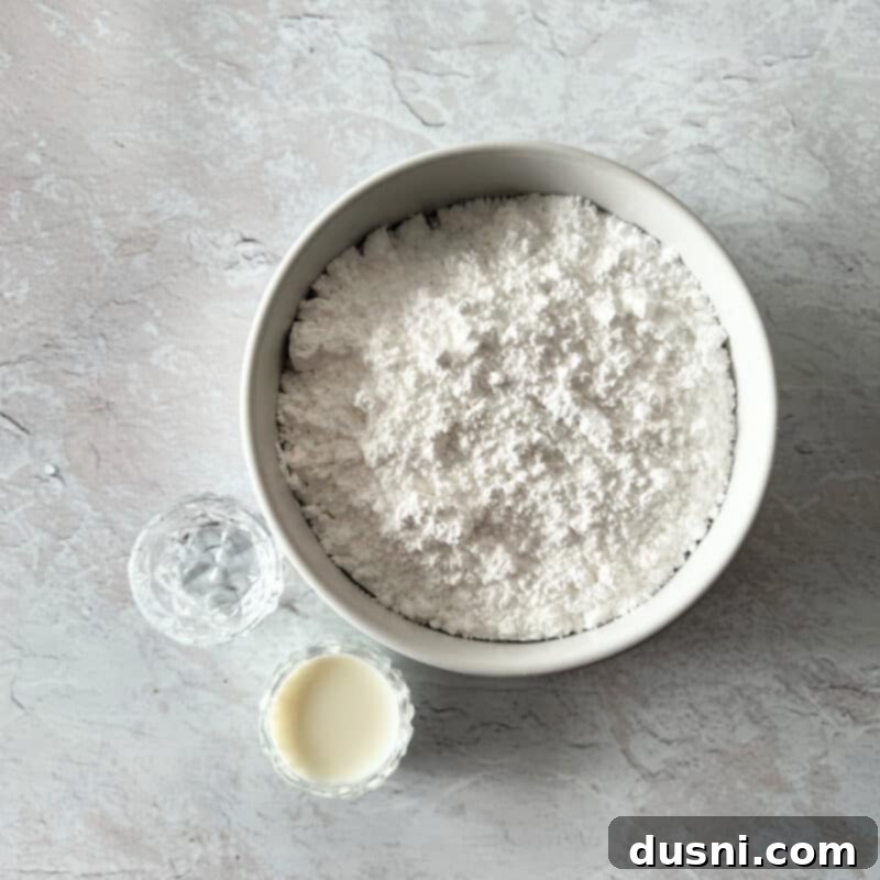 Raspberry Almond Shortbread Jewels 5 A collection of ingredients for Almond Raspberry Thumbprint Cookies, including butter, sugar, flour, and jam