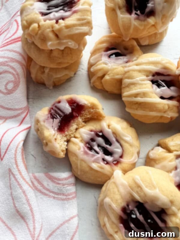 Raspberry Almond Shortbread Jewels 6 A bowl of creamy, mixed dough for almond raspberry thumbprint cookies