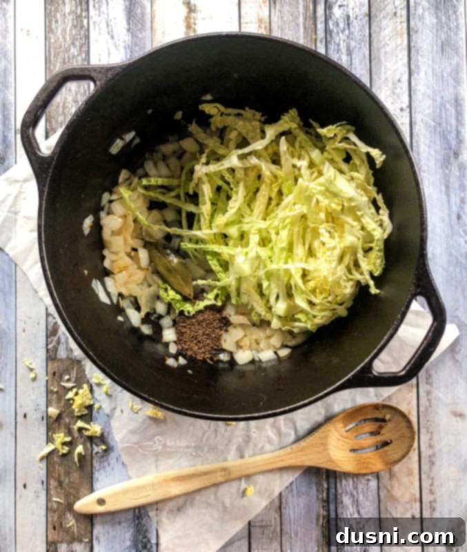 Savory Creamy Cabbage and Bleu Cheese Soup 8 Cabbage and onions cooking in a pot
