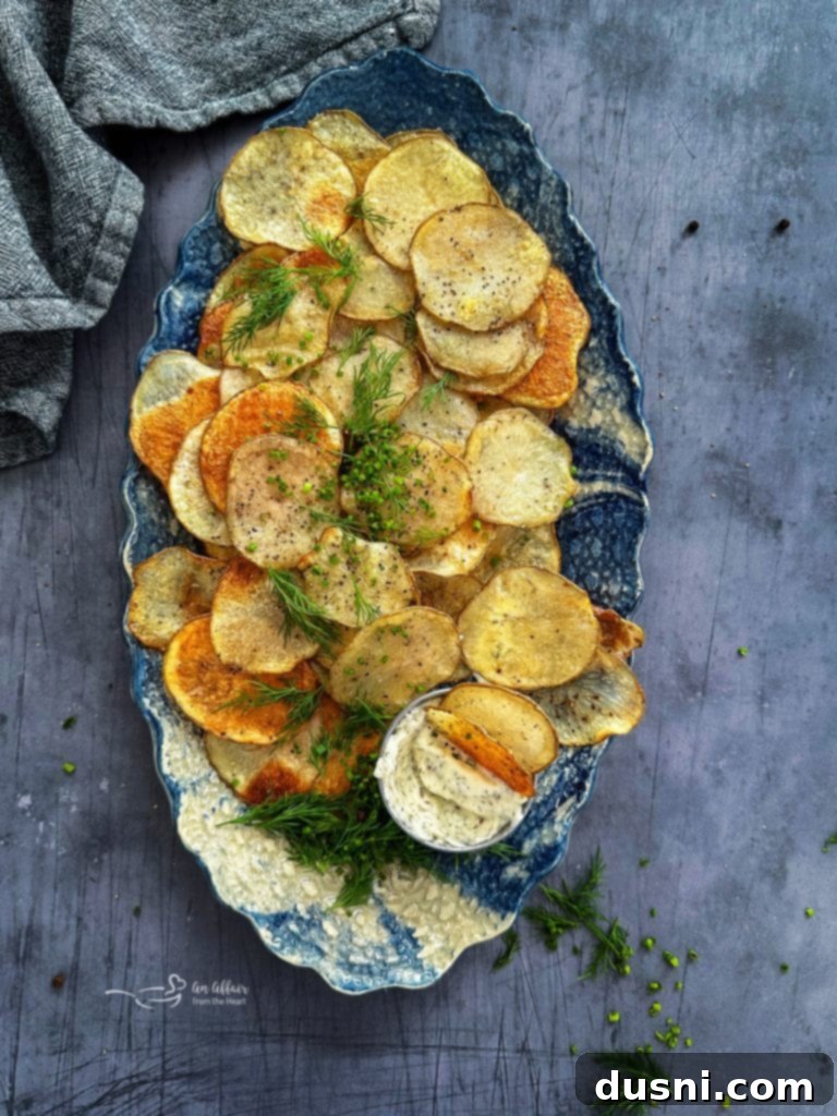 Oven-Fresh Potato Crisps 12 Crispy homemade potato chips being seasoned
