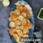 Oven-Fresh Potato Crisps 15 Homemade baked potato chips in a blue and white serving dish.