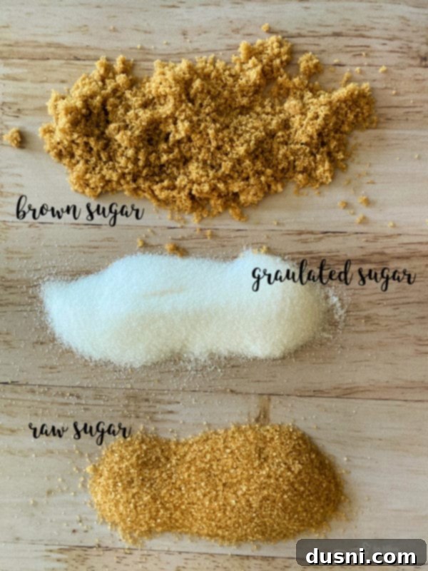 Various Jars of Homemade Sugar Scrubs on a wooden surface
