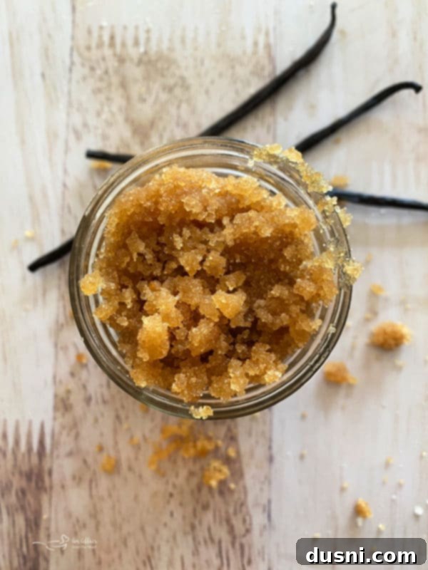 Brown Sugar Vanilla Sugar Scrub in a jar with spoon