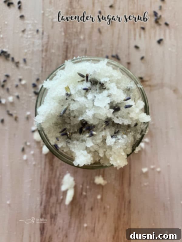 Lavender Sugar Scrub in a smaller jar with a flower