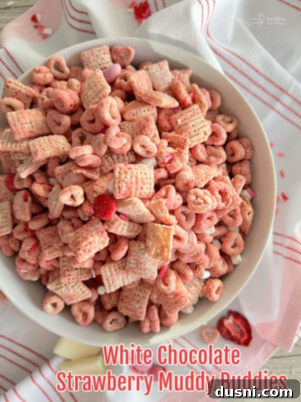 Strawberry Chex Mix A single bowl of vibrant strawberry Chex Mix, ready to be enjoyed.