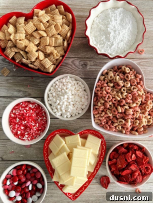 Strawberry White Chocolate Cereal Crunch 4 A vibrant bowl of White Chocolate Strawberry Muddy Buddies, showcasing its festive and sweet appeal as an easy snack or dessert.