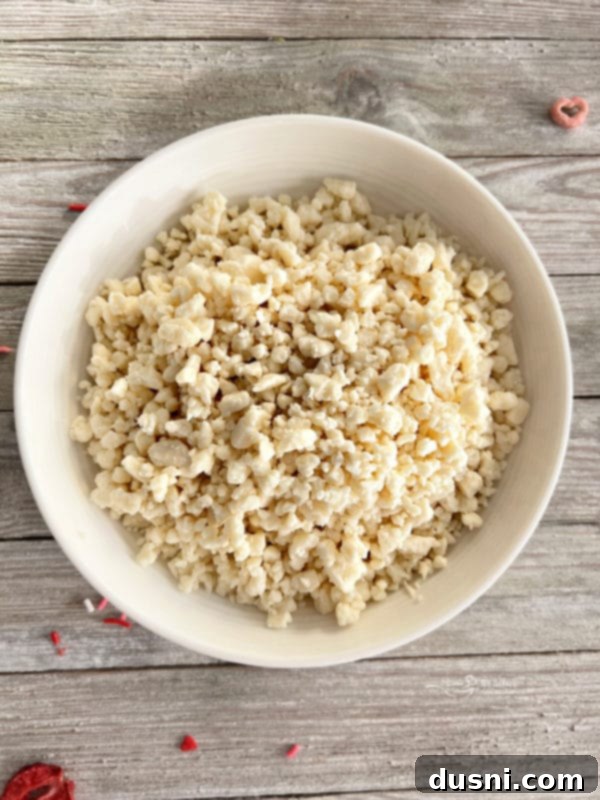 Strawberry White Chocolate Cereal Crunch 8 Melted white chocolate, ready for coating.