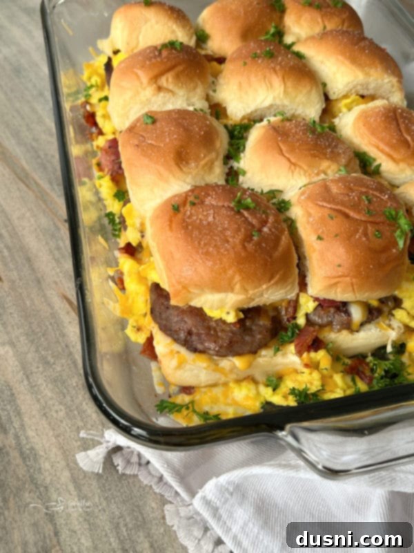 Sunrise Sliders 2 A casserole dish filled with golden-brown, cheesy breakfast sliders, ready to be served.