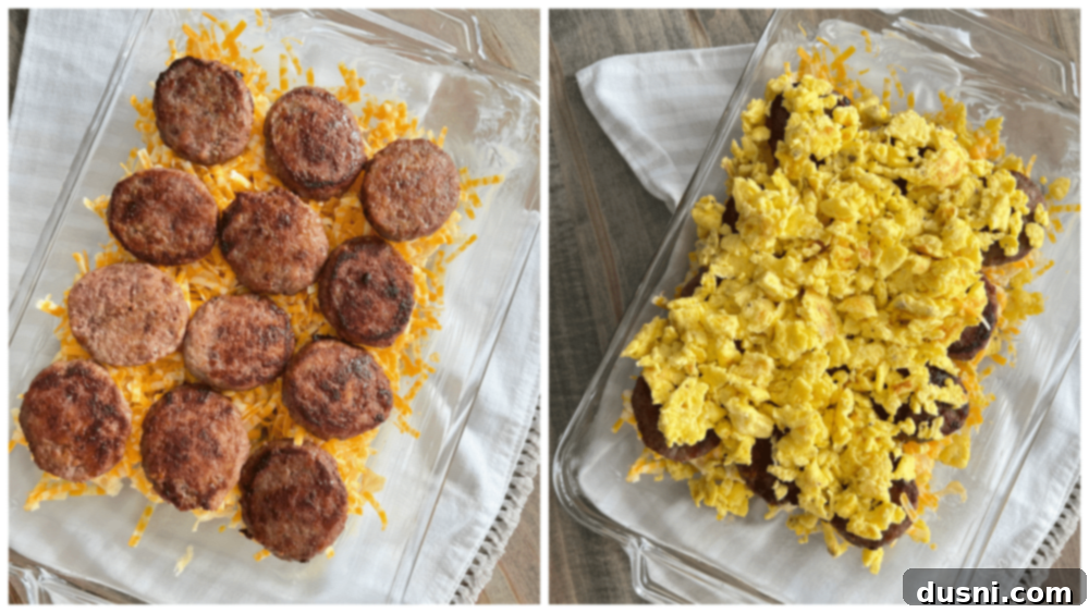 Breakfast Sausage Sliders Layers of sausage patties on top of cheese, with fluffy scrambled eggs added, in a baking pan.