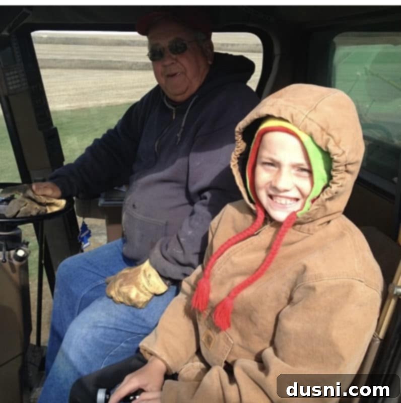 Sunrise Sliders 15 A black and white photograph of an older man, possibly the author's father-in-law, standing in front of a farm building.