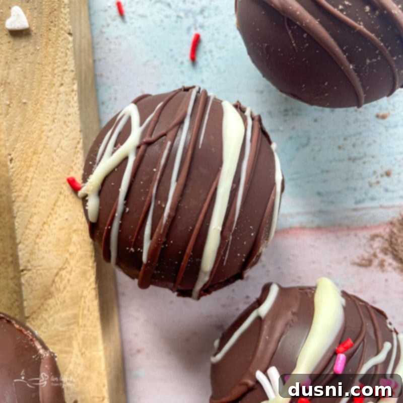 assorted hot cocoa bombs on a tray