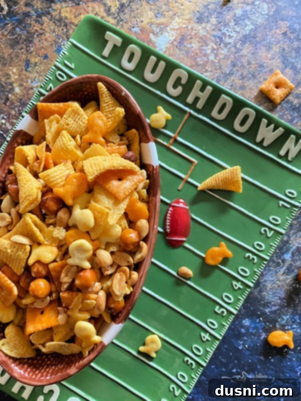 Creamy Dill & Brussels Sprout Dip 15 Touchdown Snack Mix in a football-shaped bowl