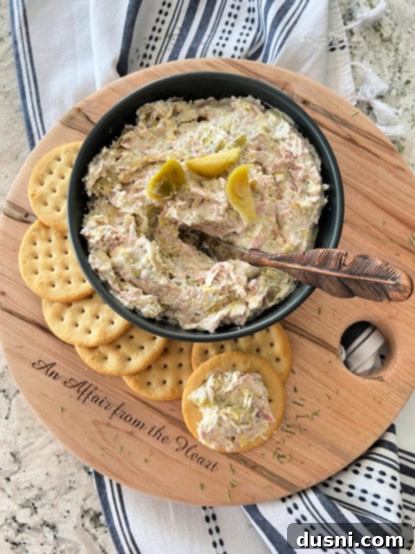 Creamy Dill & Brussels Sprout Dip 3 Close up of Dilled Brussels Sprouts Dip on a cracker with fresh dill garnish