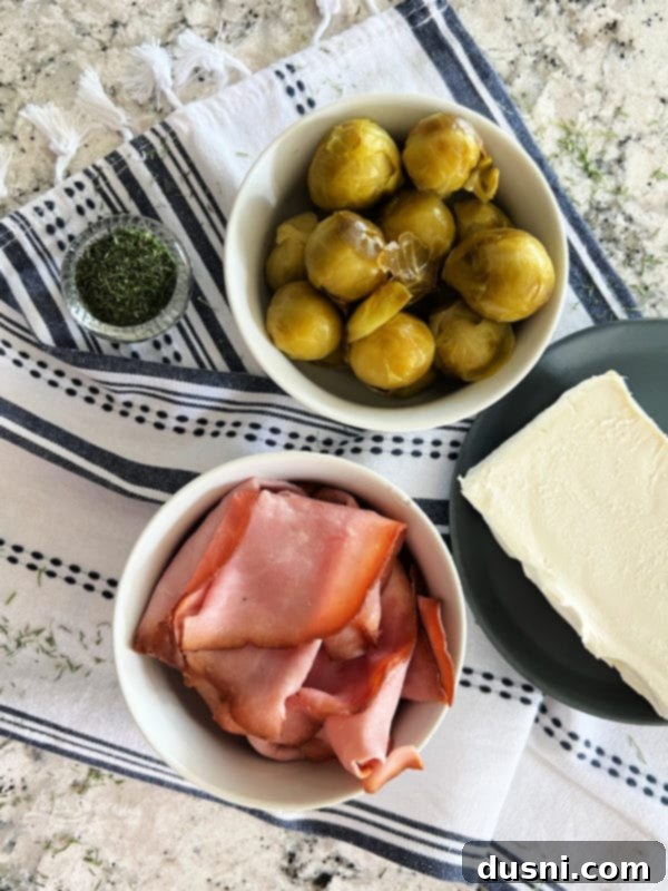 Creamy Dill & Brussels Sprout Dip 6 Ingredients for Dilled Brussels Sprouts Dip: cream cheese, chopped ham, and Paisley Farm Dilled Brussels Sprouts