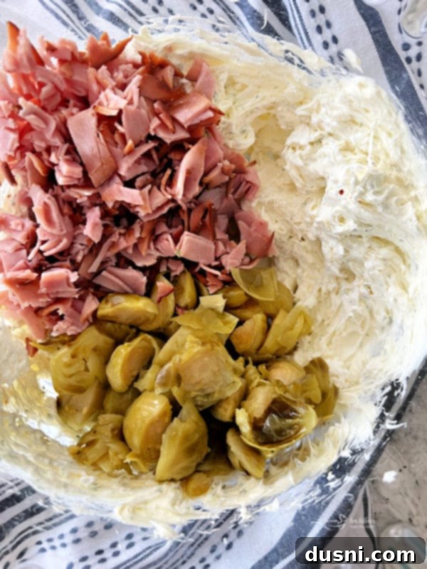 Creamy Dill & Brussels Sprout Dip 9 Whipping cream cheese and fresh dill in a mixing bowl