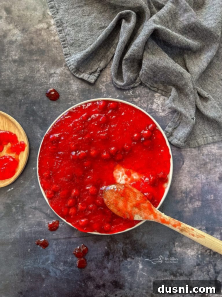 Holiday Cherry Pie Bliss 5 Close-up of the Cherry Pie Jell-O Salad, highlighting the rich cherry pieces within the Jell-O.