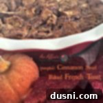 French toast bake in a red casserole dish with text "pumpkin cinnamon swirl baked french toast"