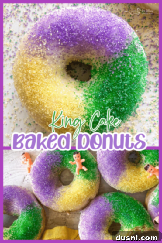A decorated King Cake donut on a wire rack, with other donuts blurred in the background, ready for a close-up.