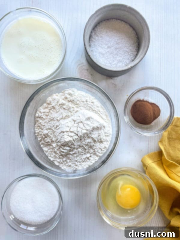 Baked King Cake donuts artfully arranged on a cooling rack, showcasing the vibrant colors of the Mardi Gras season.