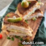 A delicious Turkey Reuben sandwich, sliced in half.