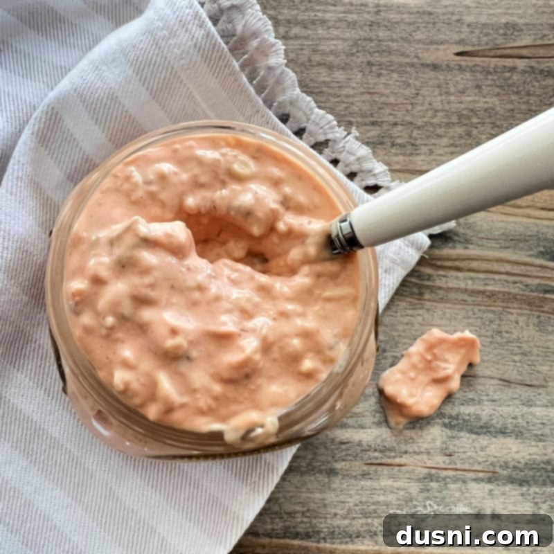 A jar of homemade Thousand Island dressing, ready to be used in the Turkey Reuben sandwich.