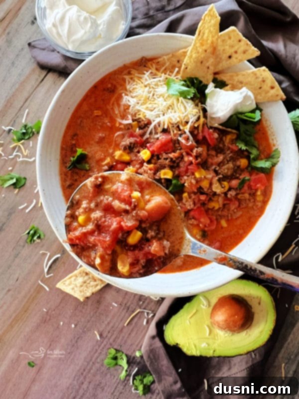 Fiesta Taco Soup 3 Beef Taco Soup in a white bowl with toppings