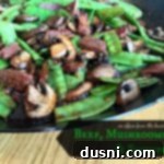 Asian Beef Stir-Fry with Sautéed Mushrooms and Crisp Snow Peas 2 Close up of Asian Beef, Mushrooms and Snow peas in a wok with text ""Asian Beef, Mushrooms and Snowpeas"