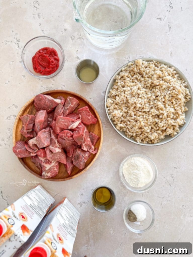 Hearty Beef and Mushroom Barley Soup 5 All the fresh ingredients for Vegetable Beef Barley Soup with Mushrooms laid out on a cutting board.