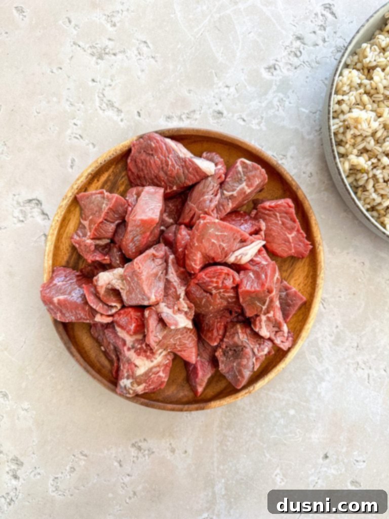 Hearty Beef and Mushroom Barley Soup 7 Sliced baby portabella and white mushrooms, ready to be added to the Beef Barley Soup.