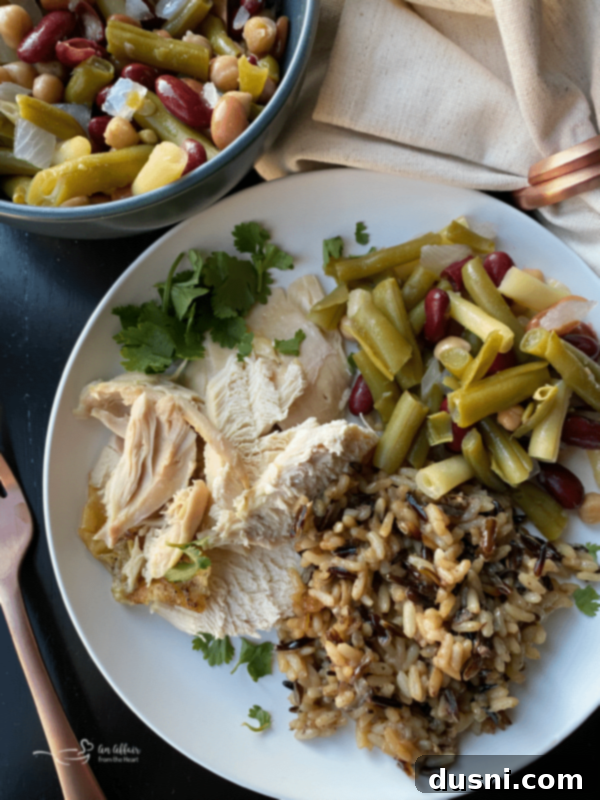 Effortless Wild Rice Stuffed Chicken 2 Golden brown baked chicken stuffed with wild rice, presented beautifully on a platter.