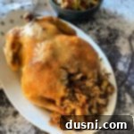 Effortless Wild Rice Stuffed Chicken 12 Baked Chicken & Wild Rice on a white serving platter